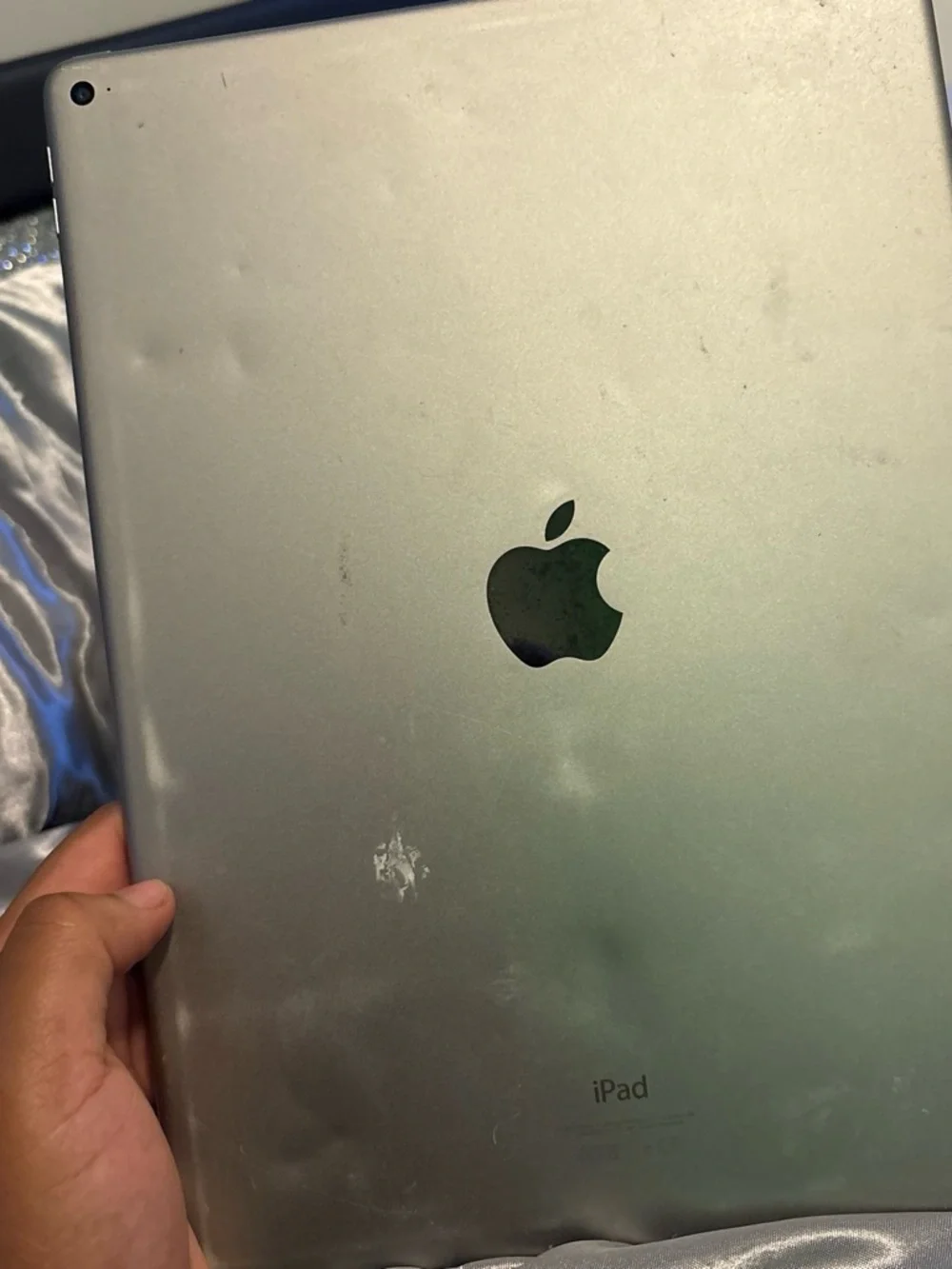 Apple Black Tablet with Green LED Dot Reflection